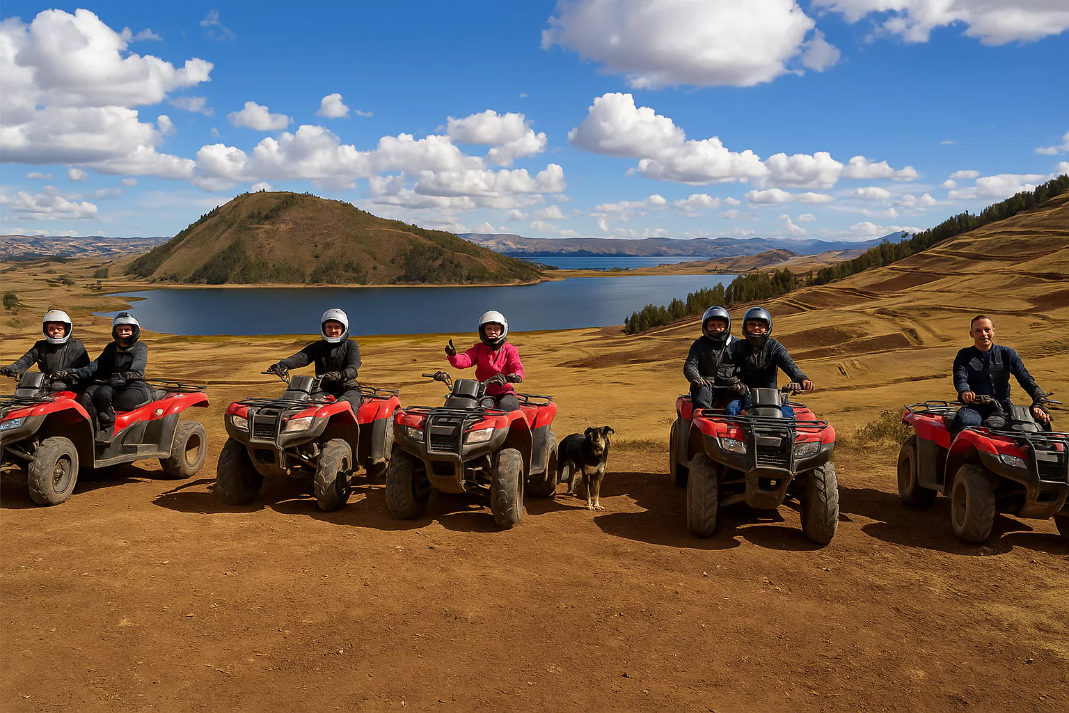 Group on ATVs posing in front of Lake Huaypo in the Sacred Valley