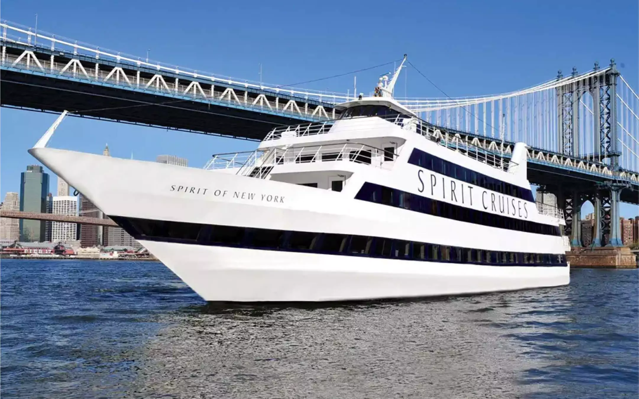 White Spirit Cruises yacht sailing near Manhattan Bridge in New York